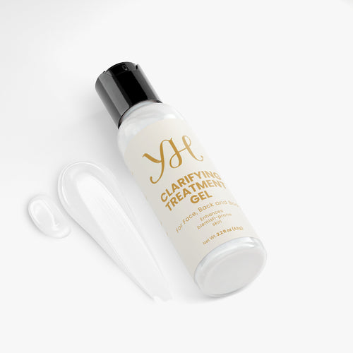 Bottle of clarifying treatment gel with a black cap on a white background